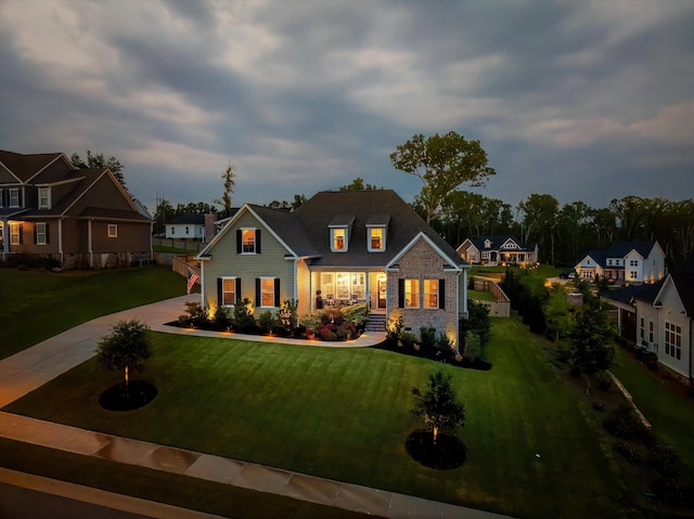 1037 Bartram Rdg, Evans, GA 30809 - view of front of property with a porch, concrete driveway, a front lawn, and a residential view