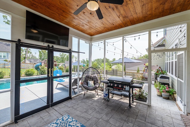 1037 Bartram Rdg, Evans, GA 30809 - sunroom featuring ceiling fan and a barn door