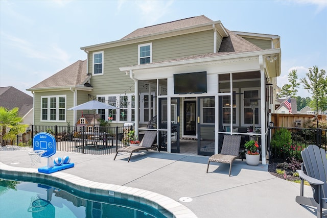1037 Bartram Rdg, Evans, GA 30809 - rear view of property with a sunroom, a patio, and a fenced backyard