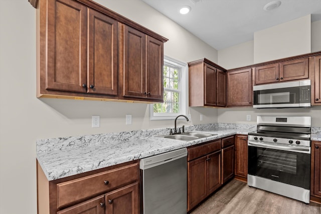 502 Shadowmoor Ct, Thomson, GA 30824 - kitchen featuring appliances with stainless steel finishes and light wood-style flooring
