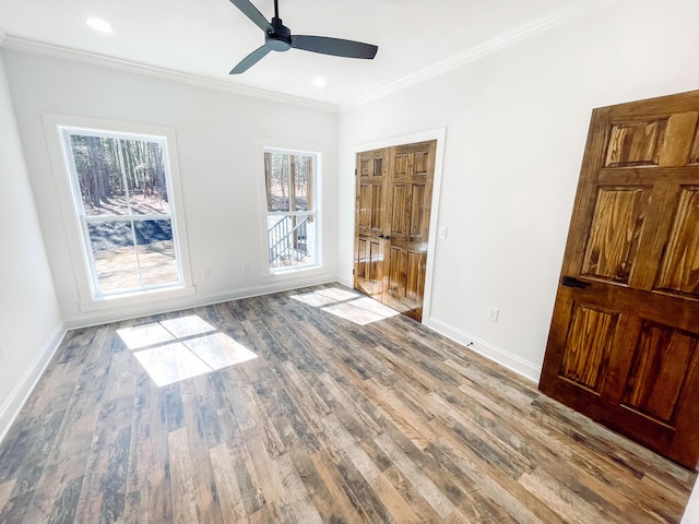 unfurnished bedroom featuring baseboards, ornamental molding, wood finished floors, and recessed lighting