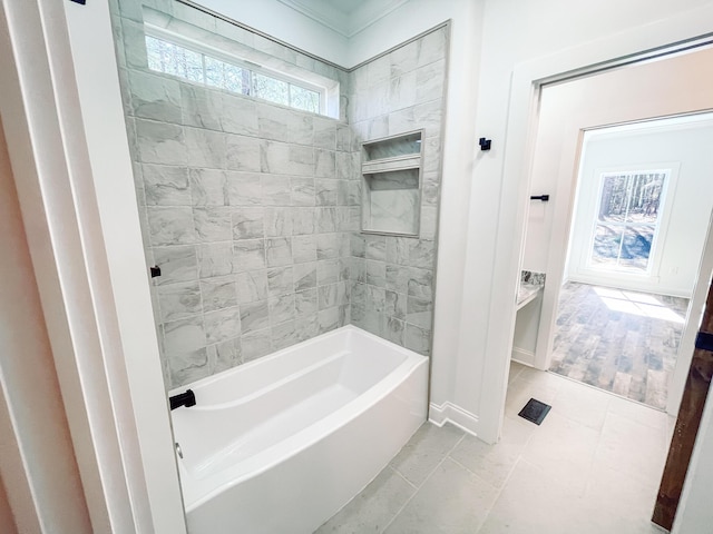 full bathroom featuring baseboards, shower / washtub combination, and tile patterned floors