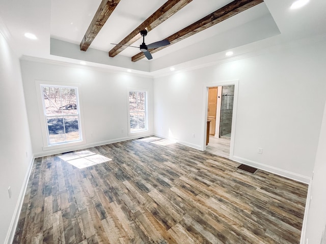 unfurnished room featuring recessed lighting, wood finished floors, beam ceiling, and baseboards