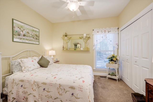 bedroom featuring carpet, multiple windows, a closet, and ceiling fan