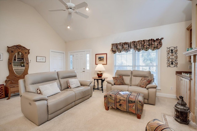 carpeted living room with ceiling fan and lofted ceiling