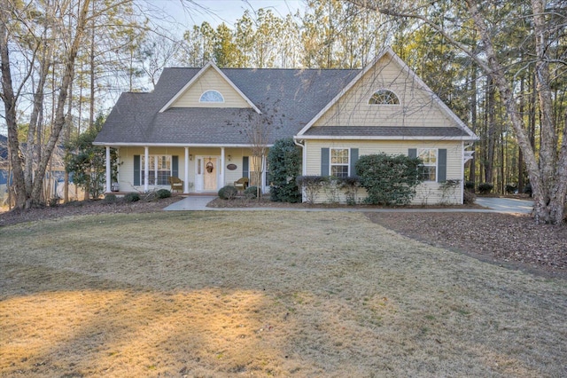 view of front of house featuring a front yard and a porch