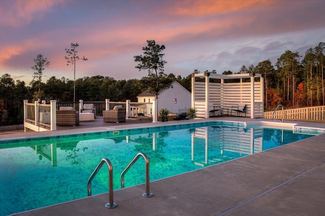 view of pool at dusk