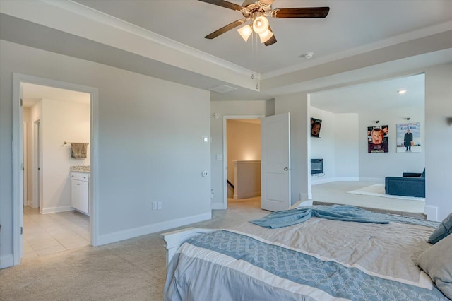 bedroom with light carpet, ensuite bathroom, and ceiling fan