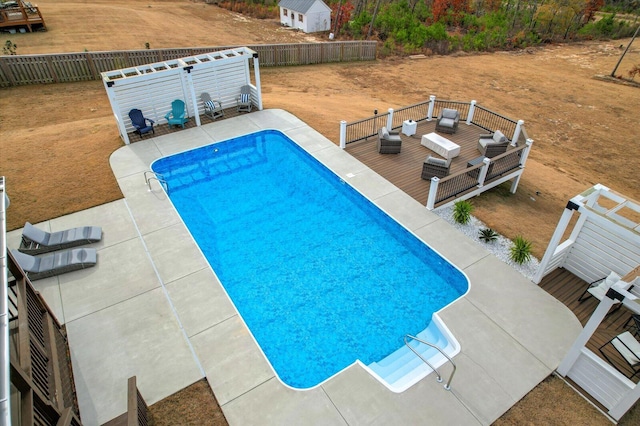 view of swimming pool featuring an outdoor living space and a patio