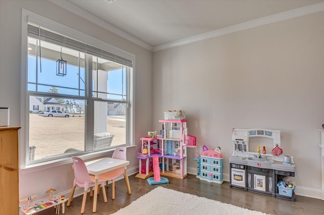 rec room with crown molding and dark wood-type flooring