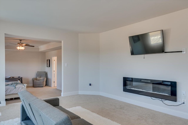 living room with light colored carpet and ceiling fan