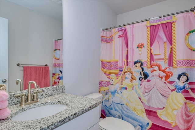 bathroom with vanity and toilet