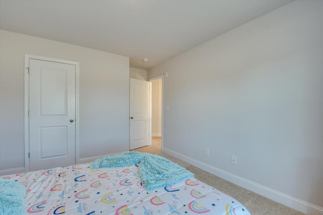 bedroom with light carpet