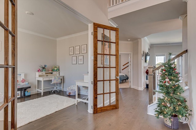 entrance foyer featuring hardwood / wood-style flooring and ornamental molding