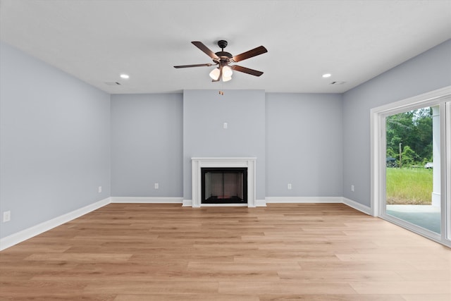 651 Moose Club Rd, Thomson, GA 30824 - unfurnished living room with light wood-style flooring, ceiling fan, recessed lighting, a fireplace, and baseboards
