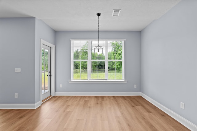 651 Moose Club Rd, Thomson, GA 30824 - unfurnished dining area featuring light wood-style floors, plenty of natural light, a chandelier, and baseboards