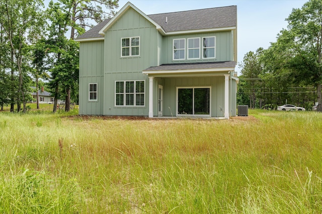 651 Moose Club Rd, Thomson, GA 30824 - rear view of house with central AC, roof with shingles, and board and batten siding