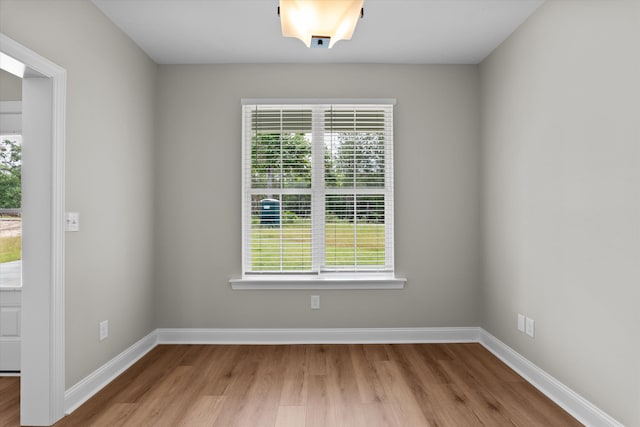 651 Moose Club Rd, Thomson, GA 30824 - unfurnished room featuring healthy amount of natural light, wood finished floors, and baseboards