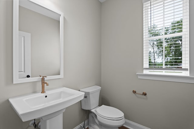 651 Moose Club Rd, Thomson, GA 30824 - bathroom with baseboards, a sink, and toilet