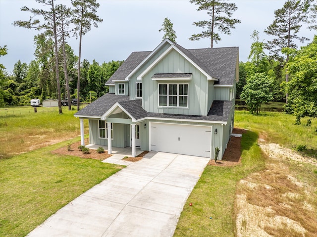 651 Moose Club Rd, Thomson, GA 30824 - modern farmhouse style home featuring roof with shingles, board and batten siding, concrete driveway, a garage, and a front lawn