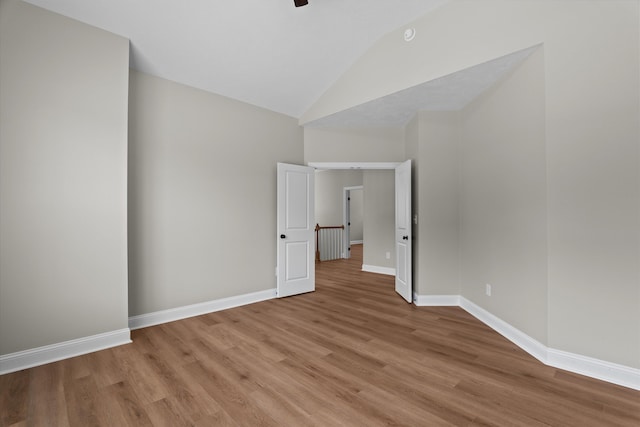 651 Moose Club Rd, Thomson, GA 30824 - unfurnished room with lofted ceiling, light wood-style floors, and baseboards