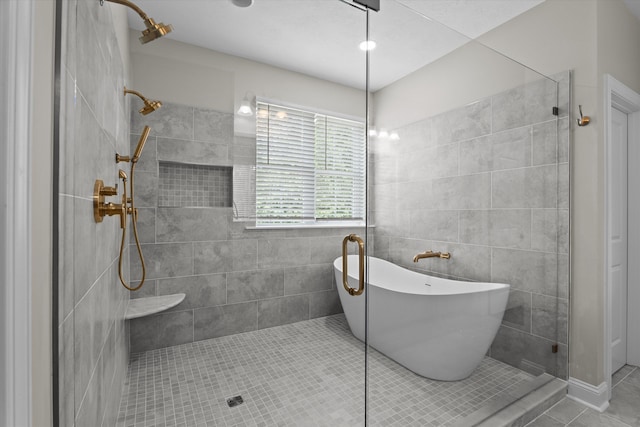 651 Moose Club Rd, Thomson, GA 30824 - bathroom featuring a tile shower, a freestanding tub, and tile patterned floors