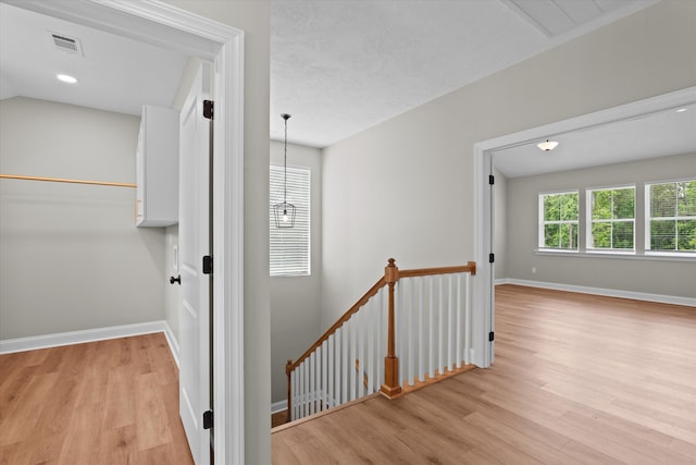 651 Moose Club Rd, Thomson, GA 30824 - corridor featuring an upstairs landing, light wood-style flooring, and baseboards