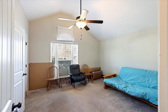 sitting room featuring carpet flooring, a ceiling fan, and lofted ceiling