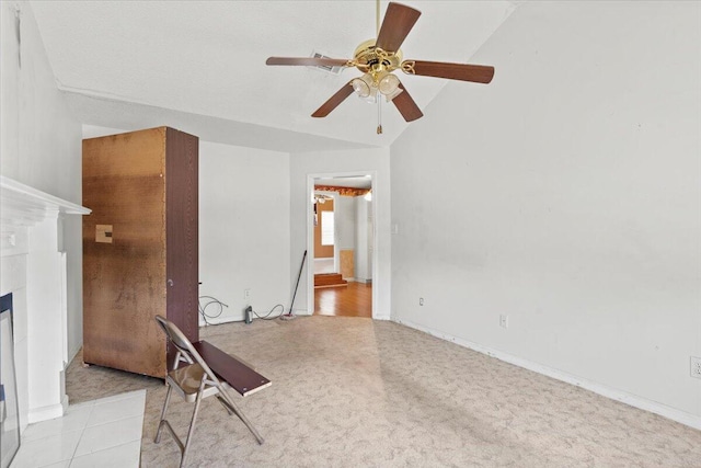 interior space featuring vaulted ceiling and ceiling fan