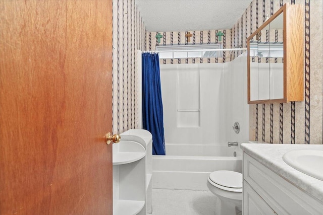 full bathroom with vanity, a textured ceiling, toilet, and shower / tub combo with curtain