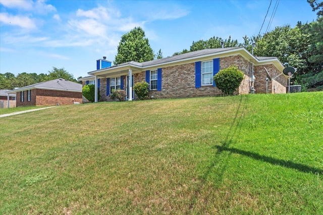 ranch-style home featuring a front yard