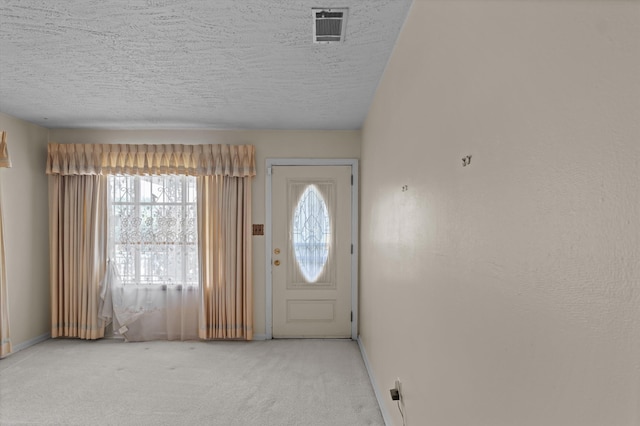 118 E Hale St, Augusta, GA 30901 - carpeted foyer featuring a textured ceiling and baseboards