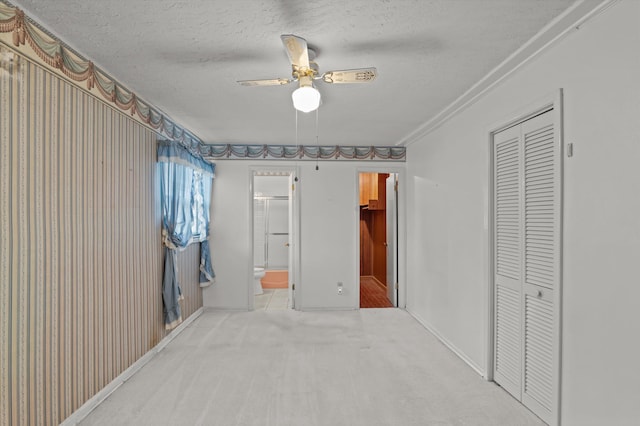 118 E Hale St, Augusta, GA 30901 - unfurnished bedroom featuring a closet, a textured ceiling, carpet flooring, a ceiling fan, and baseboards