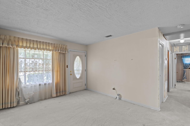 118 E Hale St, Augusta, GA 30901 - foyer entrance featuring carpet flooring, a textured ceiling, and baseboards