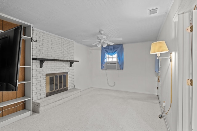 118 E Hale St, Augusta, GA 30901 - unfurnished living room with ceiling fan, a textured ceiling, cooling unit, carpet floors, and a brick fireplace