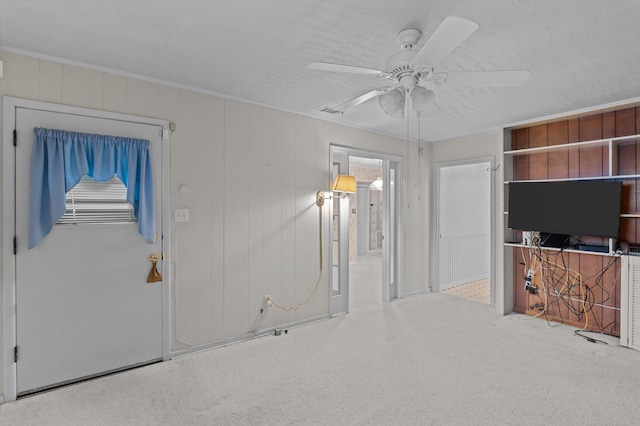 118 E Hale St, Augusta, GA 30901 - unfurnished living room with ceiling fan, carpet floors, and crown molding