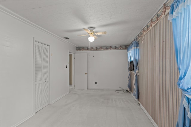 118 E Hale St, Augusta, GA 30901 - unfurnished bedroom featuring a textured ceiling, carpet, ceiling fan, a closet, and baseboards