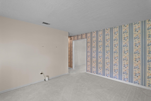 118 E Hale St, Augusta, GA 30901 - carpeted empty room with baseboards and a textured ceiling