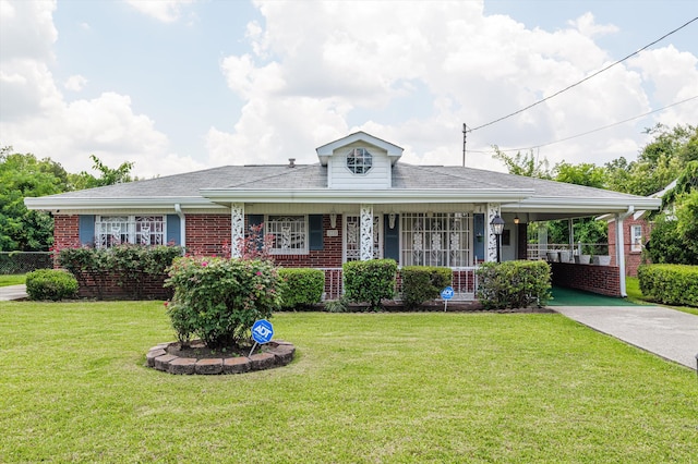 118 E Hale St, Augusta, GA 30901 - view of front facade with an attached carport, a front yard, concrete driveway, and brick siding