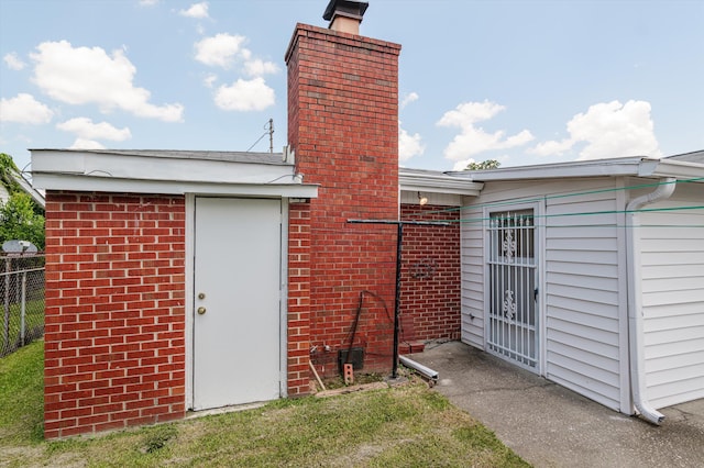 118 E Hale St, Augusta, GA 30901 - view of side of property featuring a chimney and brick siding