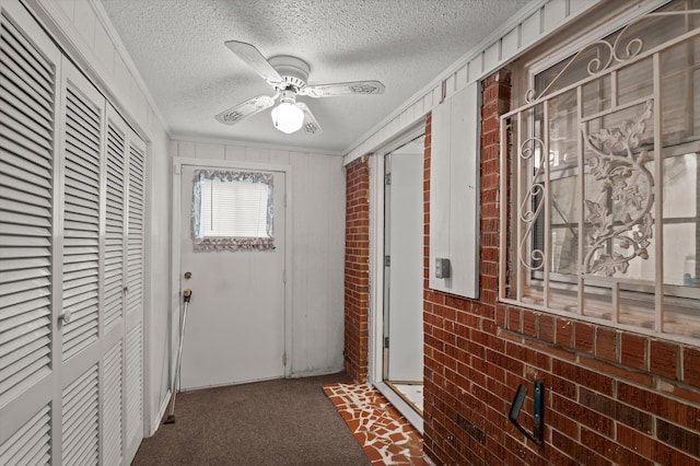 118 E Hale St, Augusta, GA 30901 - corridor with a textured ceiling, brick wall, crown molding, and carpet