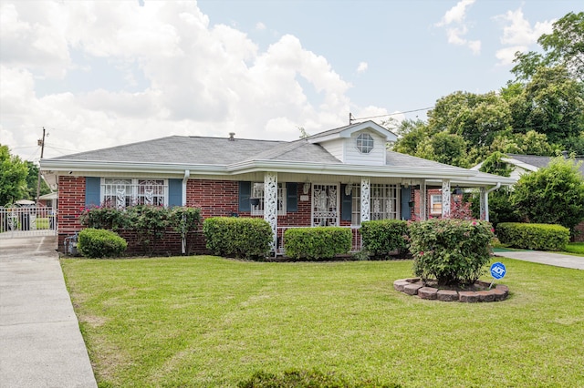 118 E Hale St, Augusta, GA 30901 - view of front of home with a front lawn, brick siding, covered porch, and concrete driveway