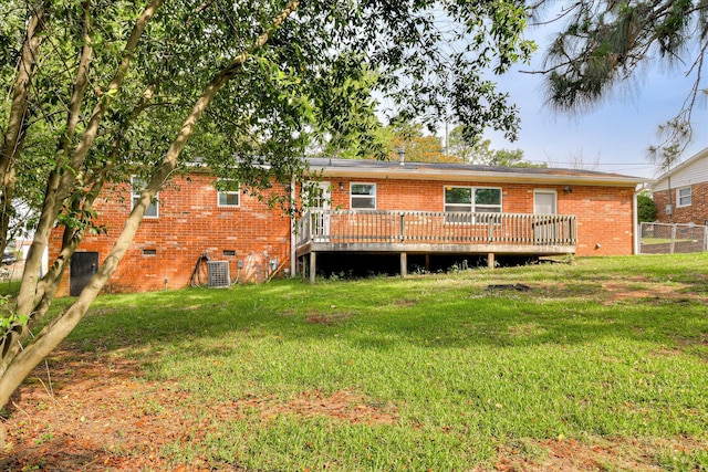 rear view of property with brick siding, a wooden deck, crawl space, and central AC unit