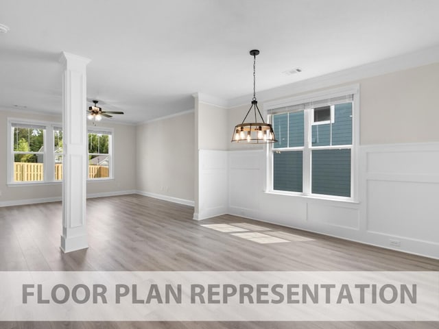 unfurnished dining area with ornate columns, visible vents, crown molding, and wood finished floors