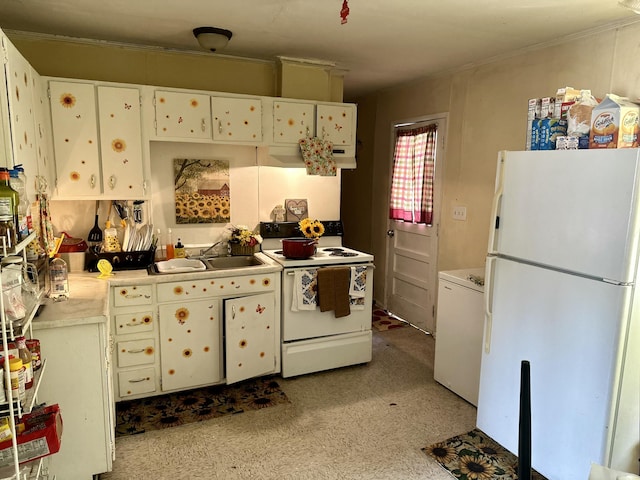 kitchen featuring white cabinetry, sink, and white appliances