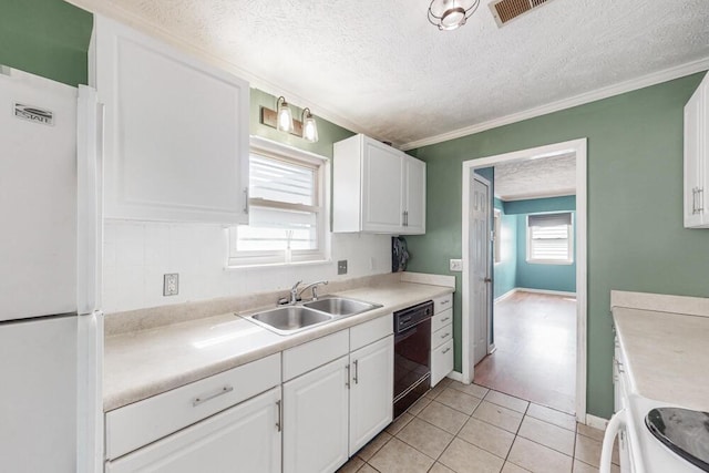 503 Mckenzie Ct, North Augusta, SC 29841 - kitchen featuring freestanding refrigerator, black dishwasher, stove, a textured ceiling, and white cabinetry
