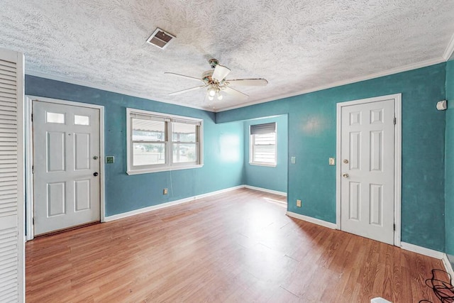 503 Mckenzie Ct, North Augusta, SC 29841 - foyer entrance featuring ceiling fan, wood finished floors, ornamental molding, and a textured ceiling