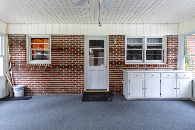 entrance to property with ceiling fan