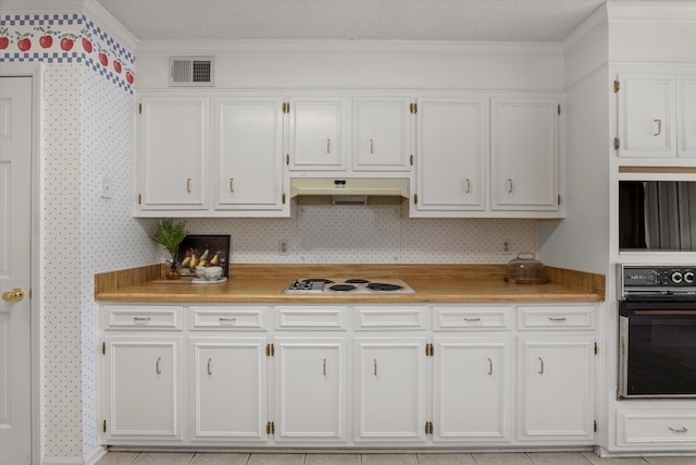114 Sigman Pl, Martinez, GA 30907 - kitchen with oven, white stovetop, under cabinet range hood, white cabinets, and light countertops