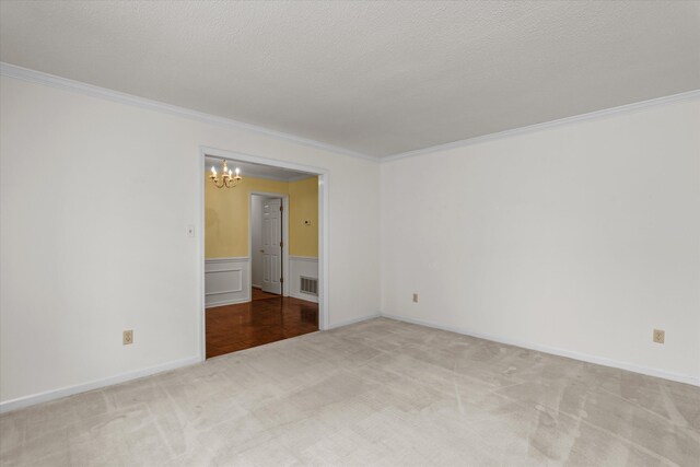114 Sigman Pl, Martinez, GA 30907 - unfurnished room with a chandelier, carpet, ornamental molding, and a textured ceiling